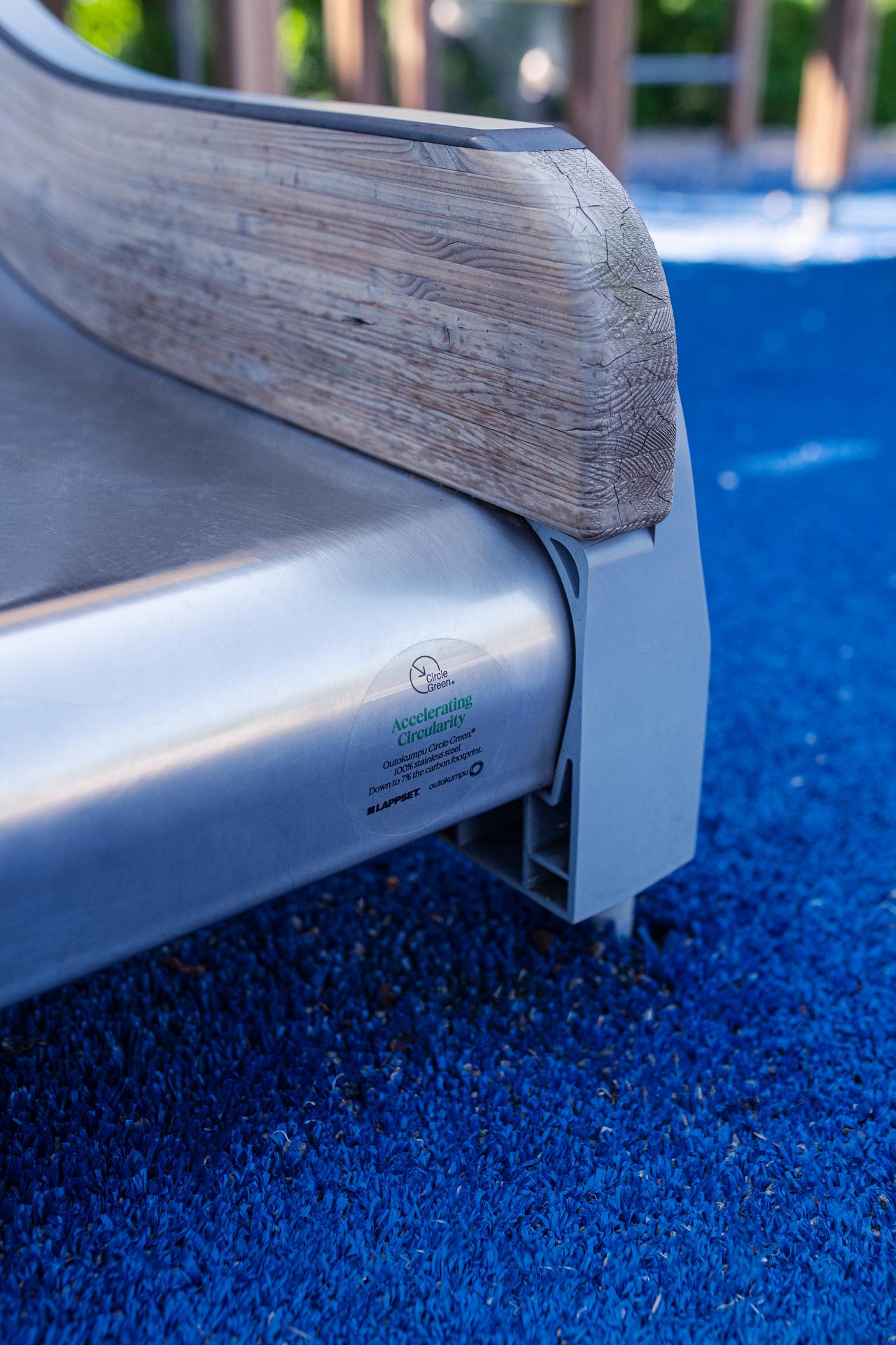 Outokumpu Circle Green stainless steel slide closeup of logo