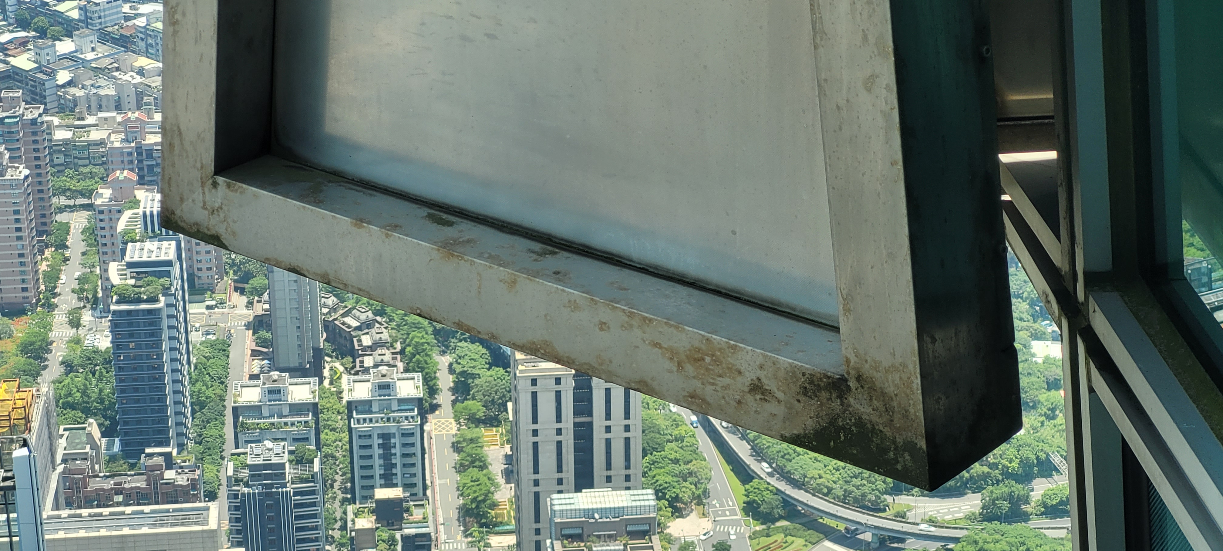 Closeup of corrosion on steel facade component